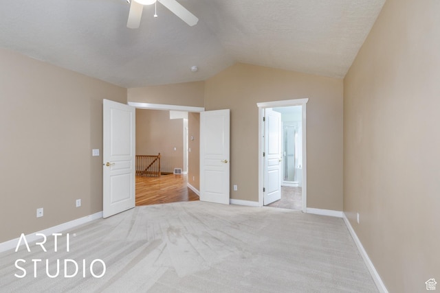 2063 N 775 E, North Ogden, UT 84414 - unfurnished bedroom featuring light carpet, vaulted ceiling, ensuite bathroom, and ceiling fan