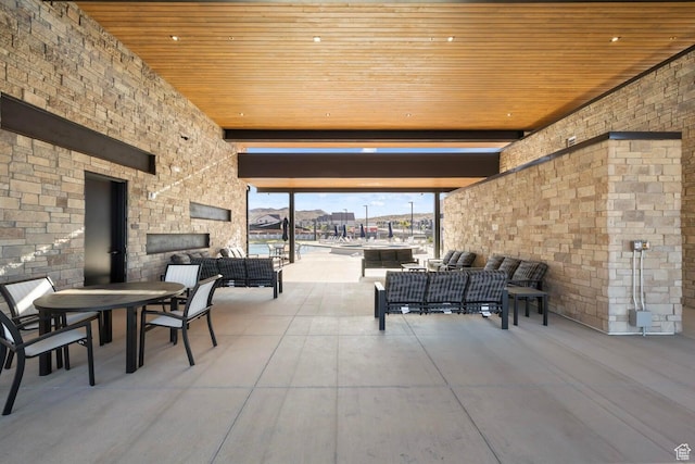 3716 E Padre Cv Unit 4094, Washington, UT 84780 - view of patio / terrace with an outdoor living space with a fireplace and outdoor dining area