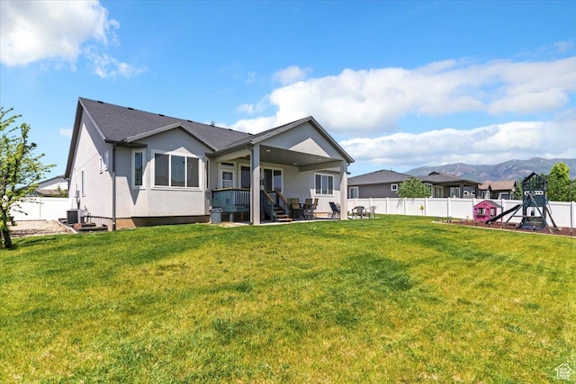 1381 W 425 S, Layton, UT 84041 - rear view of house with a fenced backyard, stucco siding, a patio, and a mountain view