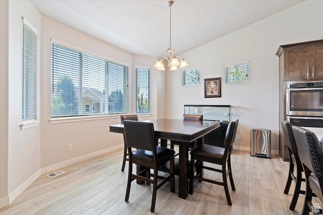 1381 W 425 S, Layton, UT 84041 - dining space featuring a chandelier, light wood-style flooring, and a textured ceiling