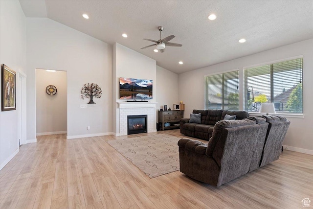 1381 W 425 S, Layton, UT 84041 - living area featuring a ceiling fan, light wood-style floors, a fireplace, high vaulted ceiling, and recessed lighting