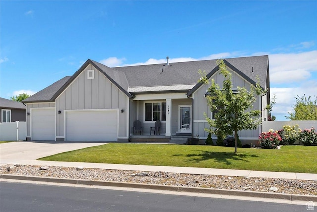 1381 W 425 S, Layton, UT 84041 - view of front facade featuring board and batten siding, a garage, driveway, and a porch