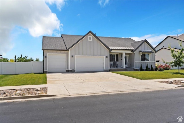 1381 W 425 S, Layton, UT 84041 - view of front facade featuring board and batten siding, an attached garage, driveway, and roof with shingles