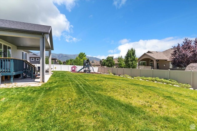 1381 W 425 S, Layton, UT 84041 - fenced backyard featuring a playground and a mountain view
