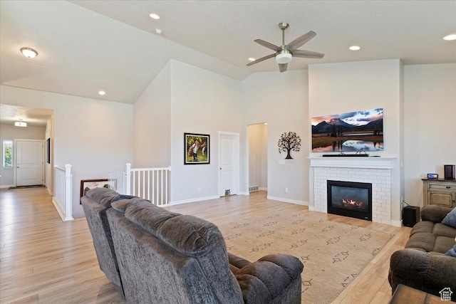 1381 W 425 S, Layton, UT 84041 - living room featuring light wood-style flooring, a ceiling fan, a brick fireplace, recessed lighting, and high vaulted ceiling