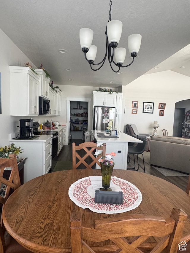 5593 W 5550 S, Hooper, UT 84315 - dining space featuring dark wood-type flooring and a chandelier