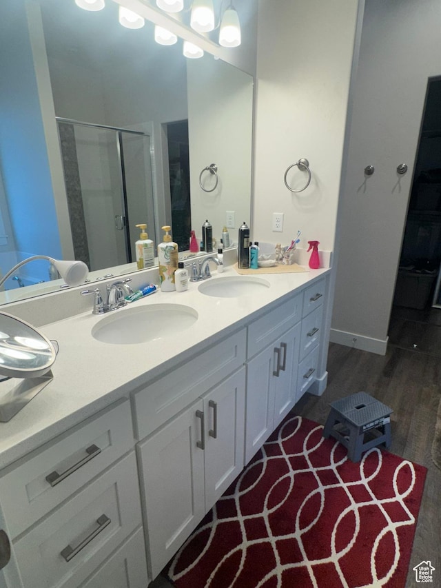 5593 W 5550 S, Hooper, UT 84315 - full bathroom with double vanity, a stall shower, and wood finished floors