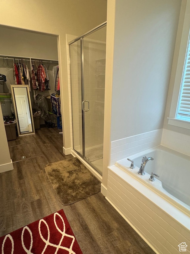 5593 W 5550 S, Hooper, UT 84315 - bathroom with wood finished floors, a bath, a stall shower, and a walk in closet
