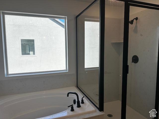 3581 W 725 S Unit 105, West Weber, UT 84401 - full bathroom with a stall shower and a bath
