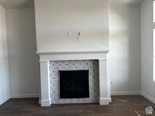 3581 W 725 S Unit 105, West Weber, UT 84401 - detailed view of a tiled fireplace and wood finished floors