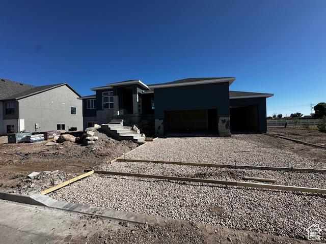 3581 W 725 S Unit 105, West Weber, UT 84401 - prairie-style home featuring driveway and a garage