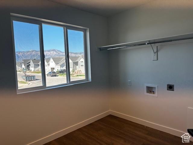 3581 W 725 S Unit 105, West Weber, UT 84401 - laundry area with electric dryer hookup, dark wood finished floors, a mountain view, washer hookup, and a residential view