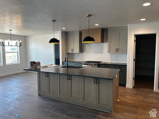 3581 W 725 S Unit 105, West Weber, UT 84401 - kitchen with gray cabinetry, a textured ceiling, dark wood-style flooring, a chandelier, and decorative backsplash
