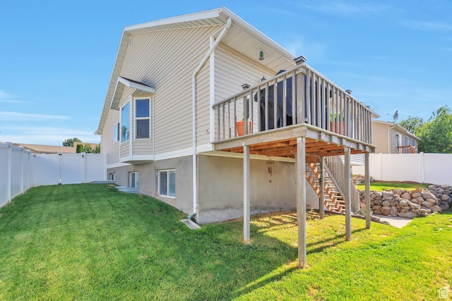 6088 W Graceland Way, West Jordan, UT 84081 - back of house featuring a fenced backyard, stairway, and a wooden deck
