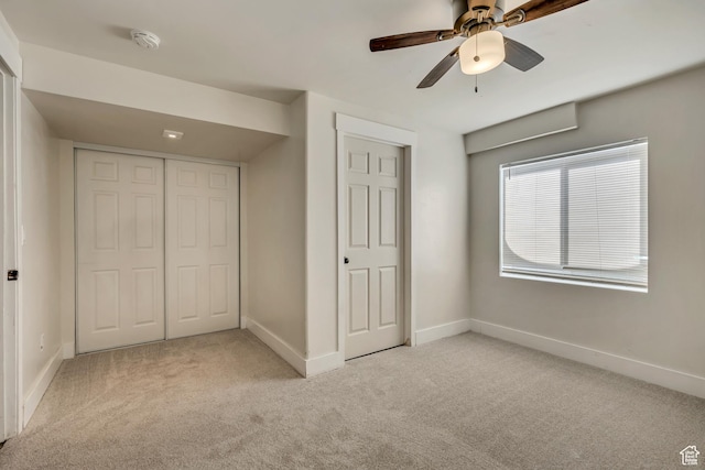 468 W Sunnyrise Ln S, Stansbury Park, UT 84074 - unfurnished bedroom with light carpet, a closet, and a ceiling fan