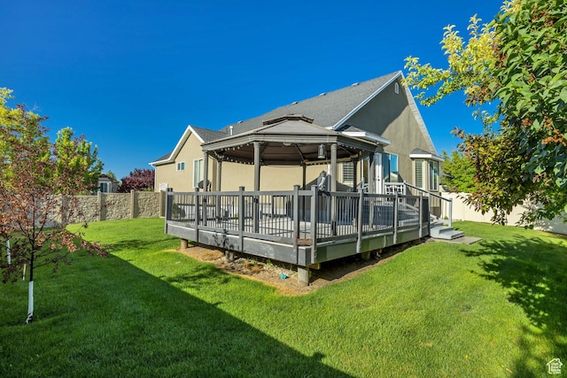 468 W Sunnyrise Ln S, Stansbury Park, UT 84074 - back of property with a gazebo, a fenced backyard, a deck, and stucco siding