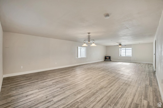 468 W Sunnyrise Ln S, Stansbury Park, UT 84074 - unfurnished living room with wood finished floors and a ceiling fan