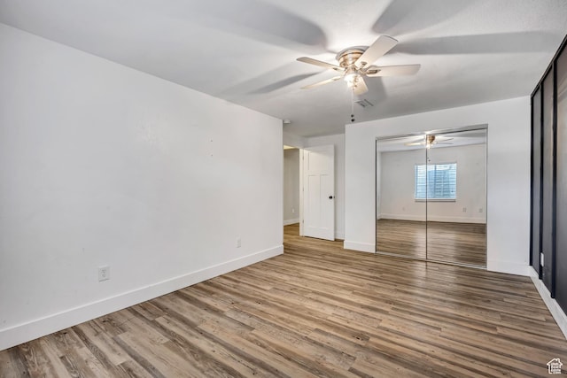 468 W Sunnyrise Ln S, Stansbury Park, UT 84074 - empty room with a ceiling fan and wood finished floors
