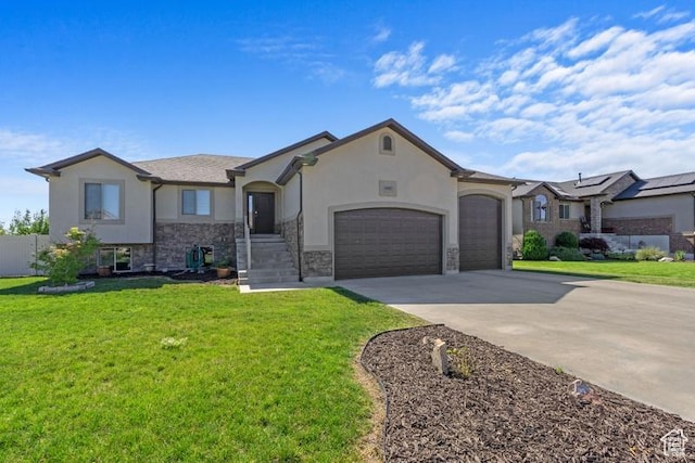 1717 N 4325 W, West Point, UT 84015 - view of front facade with stucco siding, an attached garage, driveway, and stone siding