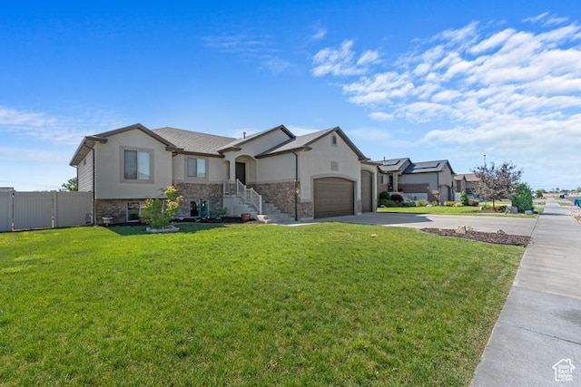 1717 N 4325 W, West Point, UT 84015 - view of front of property featuring concrete driveway, stucco siding, a garage, and stone siding