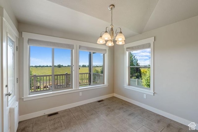 1717 N 4325 W, West Point, UT 84015 - unfurnished room with plenty of natural light, a chandelier, and vaulted ceiling