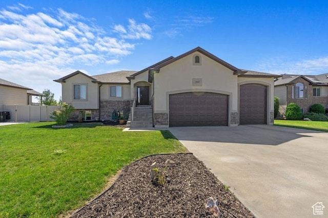 1717 N 4325 W, West Point, UT 84015 - view of front of property with concrete driveway, an attached garage, stucco siding, and stone siding