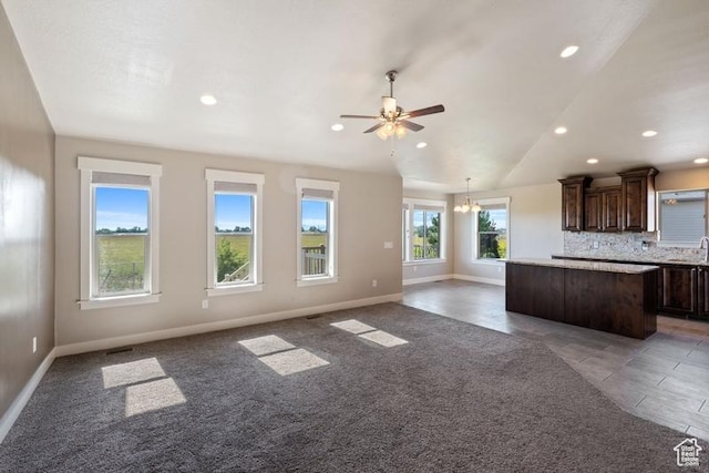 1717 N 4325 W, West Point, UT 84015 - kitchen featuring a center island, dark brown cabinetry, open floor plan, recessed lighting, and a ceiling fan