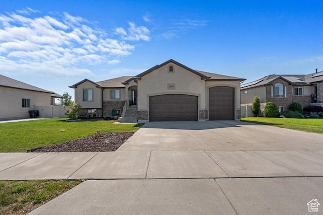 1717 N 4325 W, West Point, UT 84015 - view of front of property featuring stucco siding, concrete driveway, a garage, and stone siding