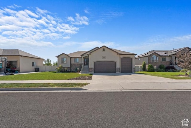 1717 N 4325 W, West Point, UT 84015 - view of front of property with an attached garage, driveway, stone siding, and stucco siding