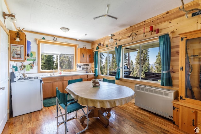0, Paradise, UT 84328 - dining room featuring light wood finished floors, wood walls, and heating unit