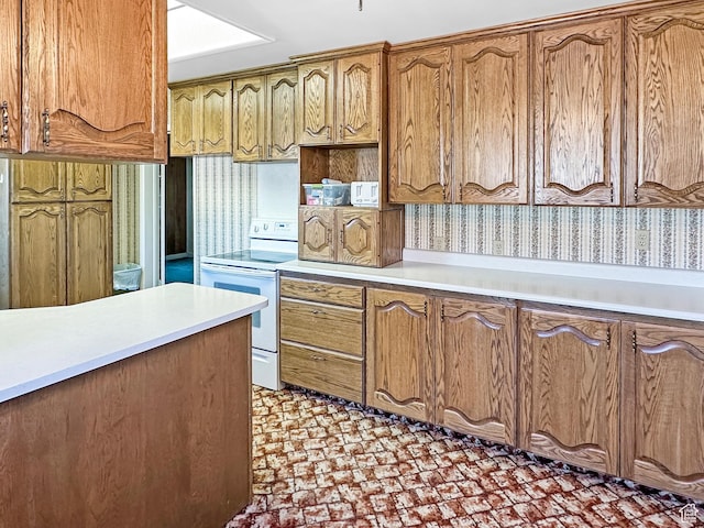 140 W 100 N, Castle Dale, UT 84513 - kitchen featuring white electric stove, brown cabinetry, light countertops, light floors, and wallpapered walls