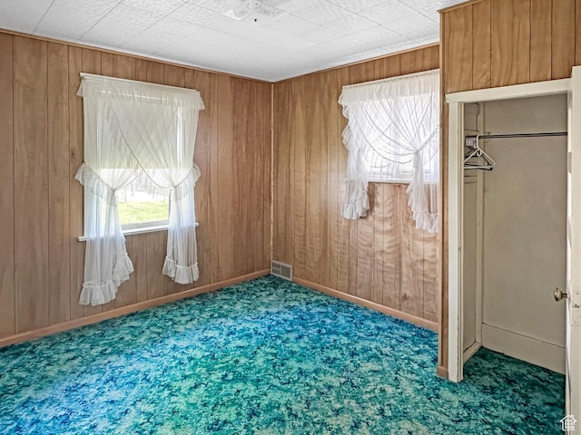 140 W 100 N, Castle Dale, UT 84513 - unfurnished bedroom with carpet floors and wood walls