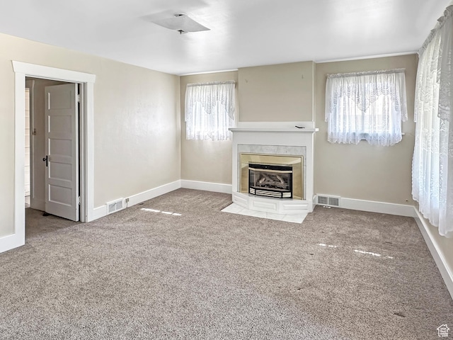 140 W 100 N, Castle Dale, UT 84513 - unfurnished living room with a tile fireplace and carpet