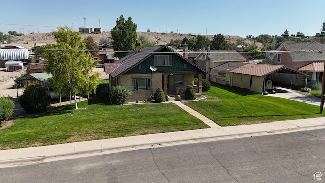 140 W 100 N, Castle Dale, UT 84513 - view of front of house with a front yard, driveway, and a residential view