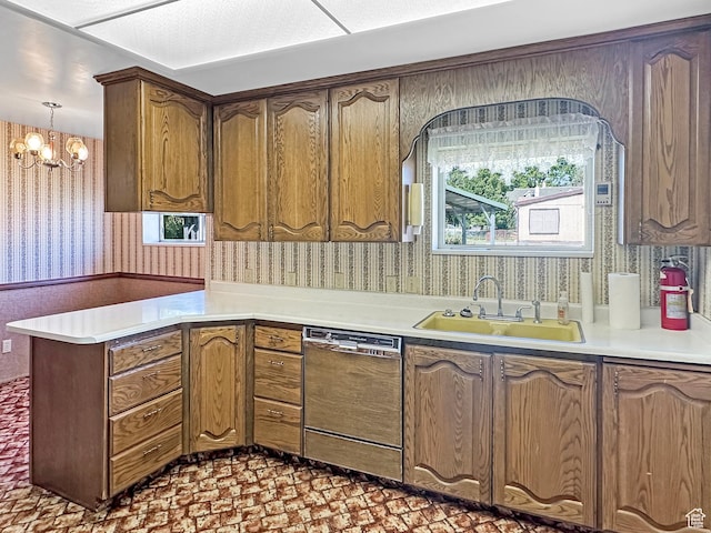 140 W 100 N, Castle Dale, UT 84513 - kitchen with wallpapered walls, dishwasher, a peninsula, a chandelier, and light countertops