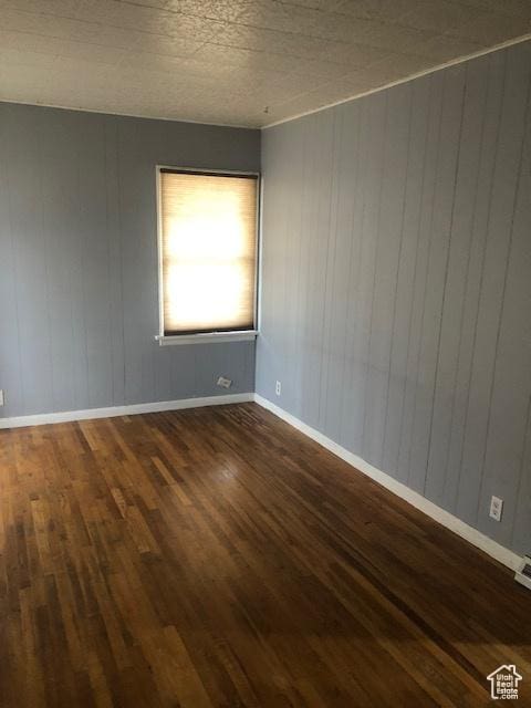 1191 E 20th, Ogden, UT 84401 - spare room featuring wood finished floors and wood walls