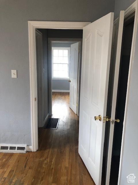 1191 E 20th, Ogden, UT 84401 - hallway with dark wood-type flooring and baseboards