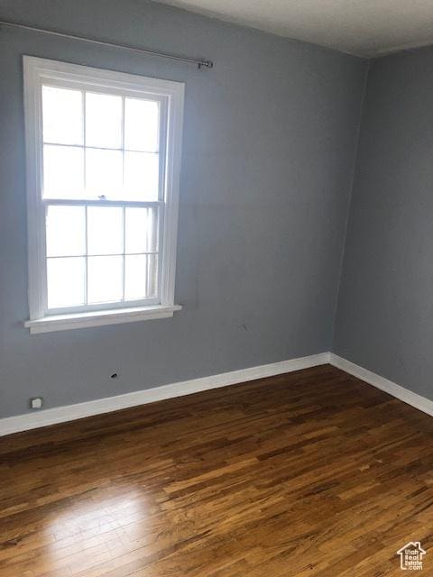 1191 E 20th, Ogden, UT 84401 - unfurnished room with dark wood finished floors