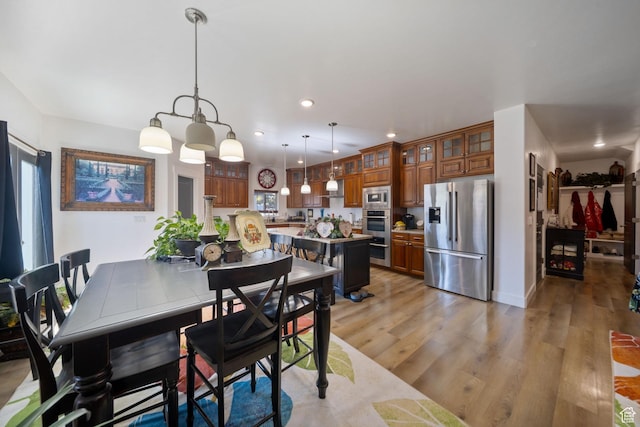 3601 S 5650 W, West Valley City, UT 84128 - dining area featuring light wood-type flooring and recessed lighting