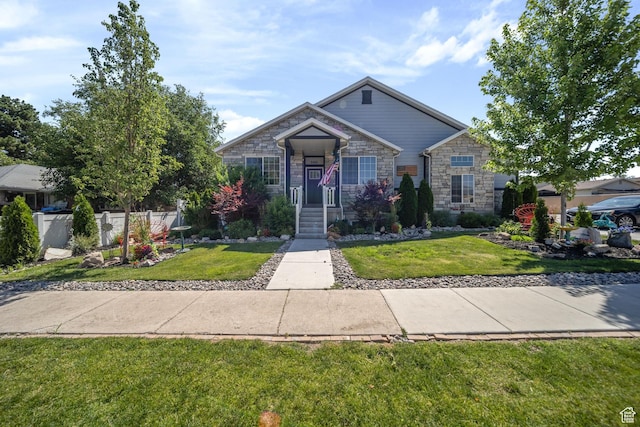 3601 S 5650 W, West Valley City, UT 84128 - view of front of property featuring stone siding and a front yard