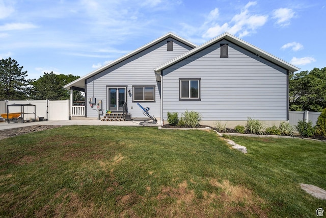 3601 S 5650 W, West Valley City, UT 84128 - rear view of property with a patio