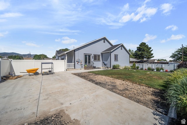 3601 S 5650 W, West Valley City, UT 84128 - back of property featuring a fenced backyard, a patio, a gate, and entry steps
