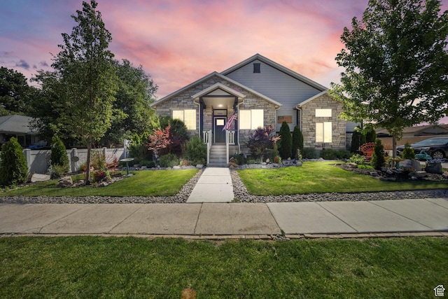3601 S 5650 W, West Valley City, UT 84128 - view of front of house with stone siding and a yard