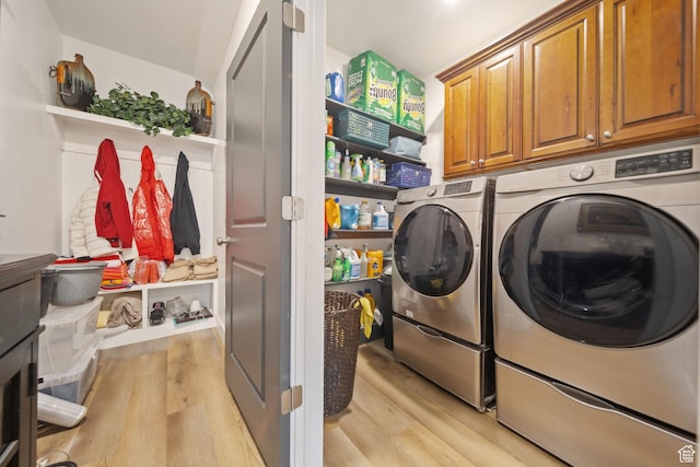 3601 S 5650 W, West Valley City, UT 84128 - laundry area with washer and clothes dryer, light wood-style floors, and cabinet space
