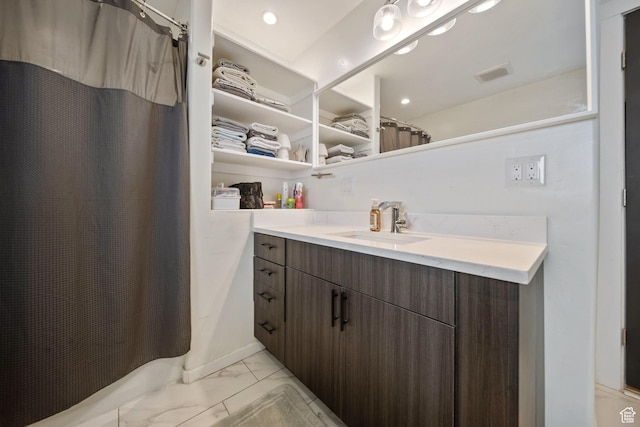 3601 S 5650 W, West Valley City, UT 84128 - bathroom with marble look tile flooring, vanity, a shower with shower curtain, and recessed lighting