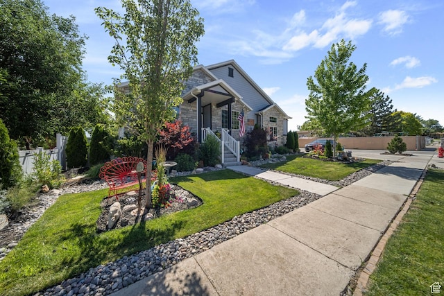 3601 S 5650 W, West Valley City, UT 84128 - view of front of property featuring stone siding and a porch