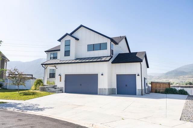 1272 E 1470 N, Payson, UT 84651 - modern inspired farmhouse featuring a standing seam roof, board and batten siding, a mountain view, driveway, and an attached garage