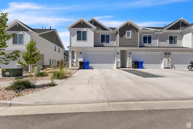 631 W 550 N, Smithfield, UT 84335 - multi unit property with an attached garage, board and batten siding, concrete driveway, and stone siding