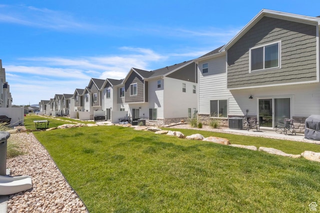 631 W 550 N, Smithfield, UT 84335 - rear view of property with a residential view, a yard, and a patio