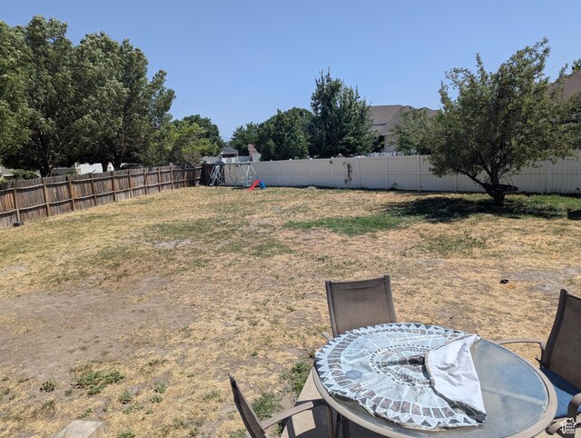 1831 W Dale Ridge Ave N, Salt Lake City, UT 84116 - fenced backyard with a playground